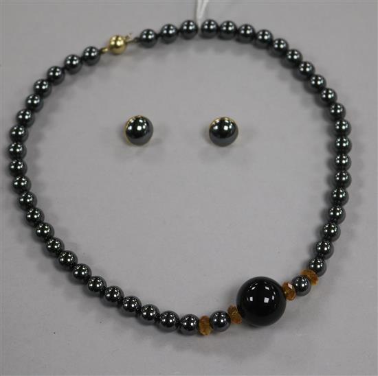 A hematite and hardstone necklace with 9ct clasp and a pair of 9ct gold and hematite earrings.